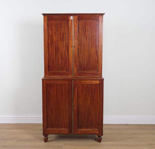 A GEORGE III MAHOGANY DOUBLE HEIGHT FOUR DOOR CUPBOARD