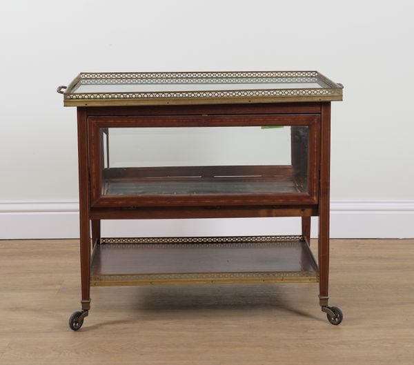 AN EDWARDIAN MAHOGANY FRAMED BEVELLED GLASS SERVING TROLLEY