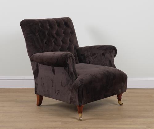 A BROWN UPHOLSTERED SQUARE BACK EASY ARMCHAIR