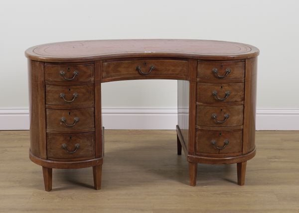 AN EDWARDIAN INLAID MAHOGANY KIDNEY SHAPED NINE DRAWER KNEEHOLE WRITING DESK