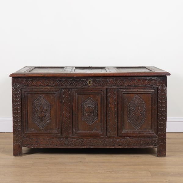 AN 18TH CENTURY CARVED OAK COFFER