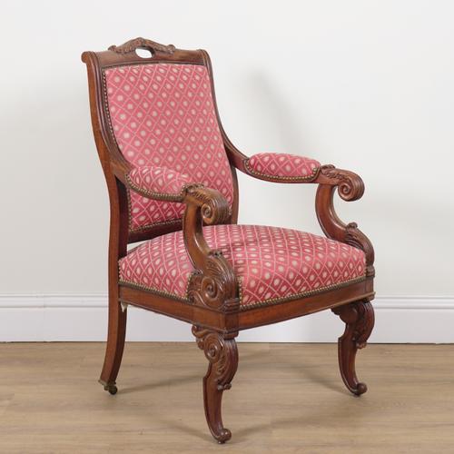 AN ANGLO-INDIAN CARVED TEAK OPEN ARMCHAIR