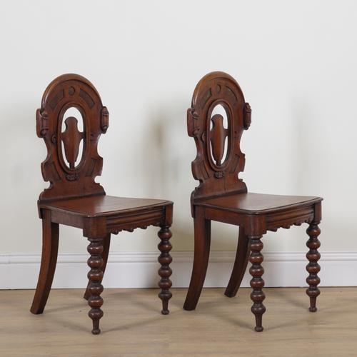 A PAIR OF VICTORIAN OAK HALL CHAIRS (2)