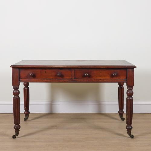 A REGENCY MAHOGANY TWO DRAWER WRITING TABLE