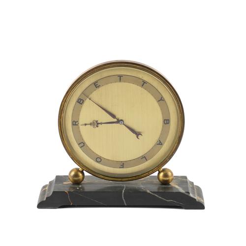 A GILT-METAL 'BETTY BALFOUR' TIMEPIECE