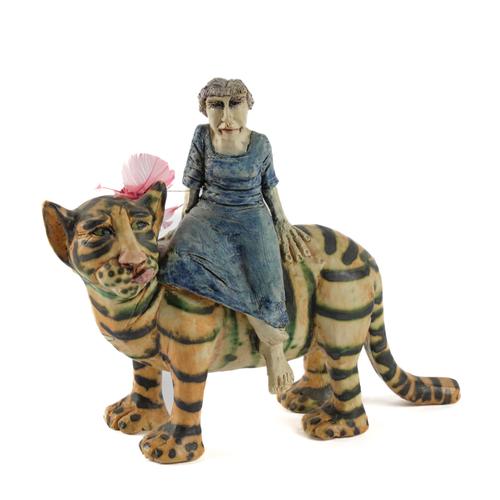 AMANDA POPHAM (BRITISH, B.1954): A STUDIO POTTERY MODEL OF A WOMAN RIDING A TIGER