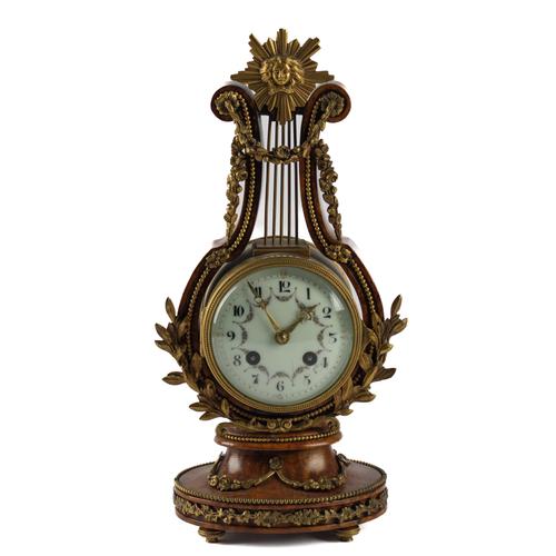 A FRENCH WALNUT AND GILT-METAL MOUNTED LYRE TIMEPIECE