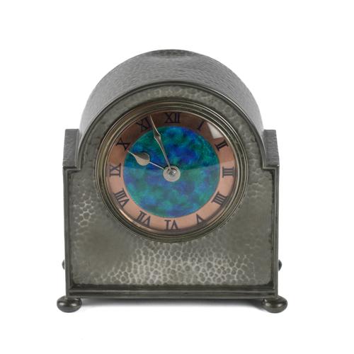 LIBERTY & CO: A TUDRIC PEWTER CASED ENAMELLED CLOCK