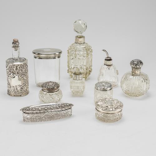 A GROUP OF TEN SILVER MOUNTED GLASS TOILET BOTTLES AND JARS (10)