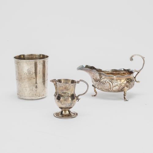 A SILVER SAUCEBOAT, A SMALL CREAM JUG AND A EUROPEAN BEAKER (3)