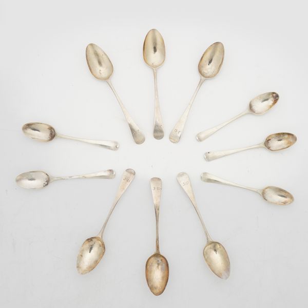 A SET OF SIX SILVER TEASPOONS AND A PART SET OF FIVE SILVER TEASPOONS (11)