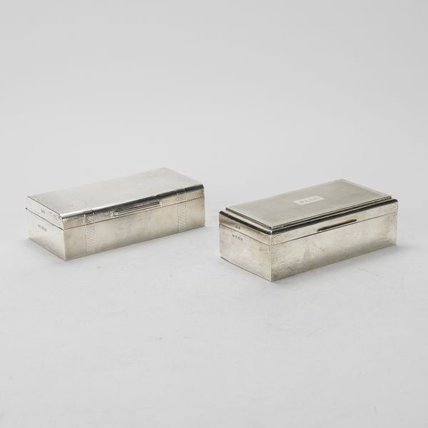 TWO SILVER RECTANGULAR TABLE CIGARETTE BOXES (2)
