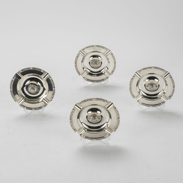 A SET OF FOUR SILVER ASHTRAYS (4)