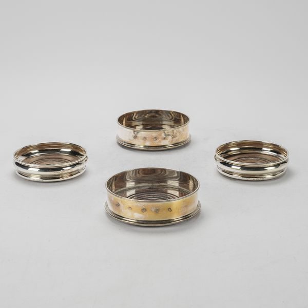TWO PAIRS OF SILVER MOUNTED BOTTLE COASTERS (4)