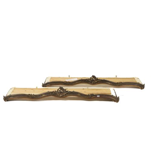 A PAIR OF ROCOCO STYLE GILT COMPOSITION AND GILT WOOD CURTAIN PELMETS (2)