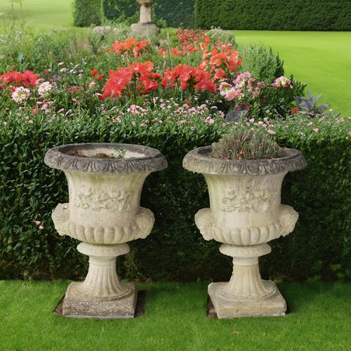 A PAIR OF RECONSTITUTED STONE JARDINIERES (2)