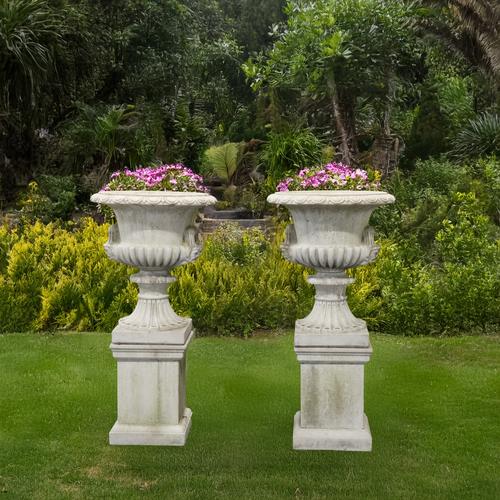 A PAIR OF RECONSTITUTED STONE TWIN HANDLE JARDINIERES (2)