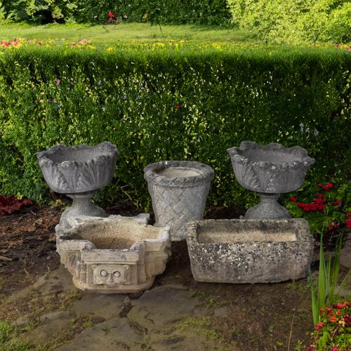 A PAIR OF RECONSTITUTED STONE ACANTHUS LEAF MOLDED JARDINIERES (5)