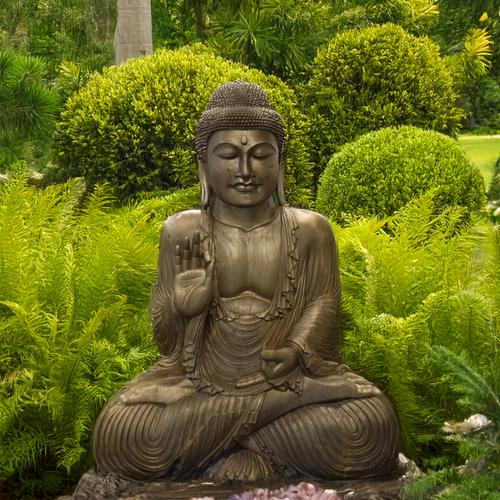 A LARGE GOLD PAINTED HARDWOOD FIGURE OF A SEATED BUDDHA