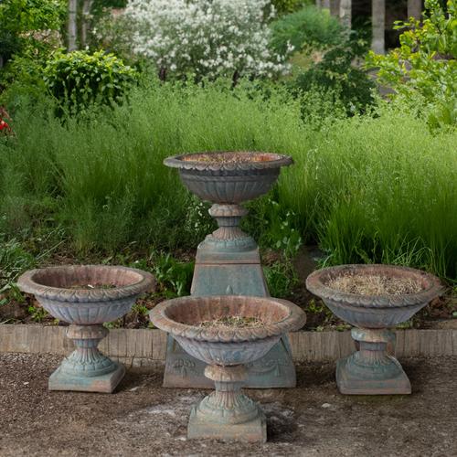 TWO PAIRS OF LATE 19TH CENTURY GREEN PAINTED CAST IRON JARDINIERES (5)