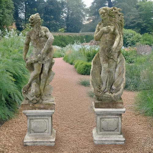 A PAIR OF RECONSTITUTED STONE NAUTICAL THEMED FIGURES (2)