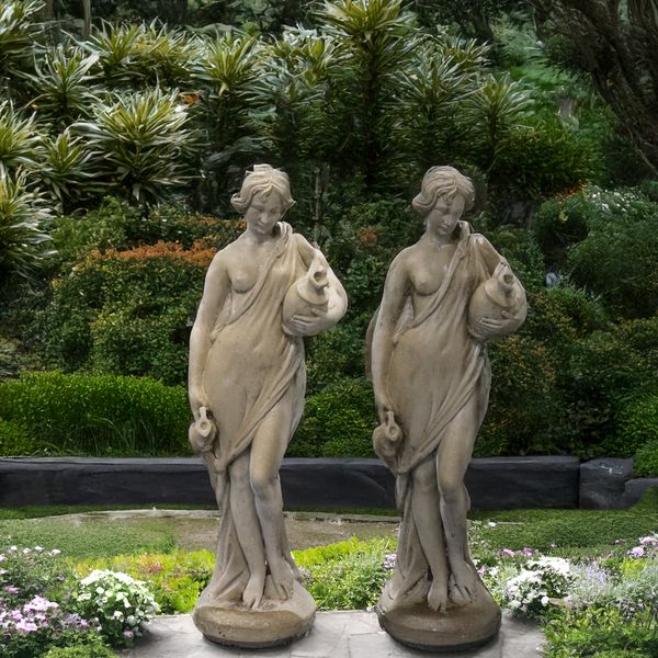 A PAIR OF RECONSTITUTED STONE WATER CARRIER FIGURES (2)