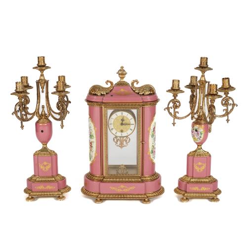 AN ORMOLU AND PINK PORCELAIN CLOCK GARNITURE (3)