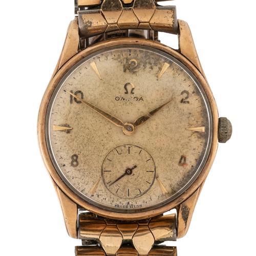 A GOLD OMEGA WATCH
