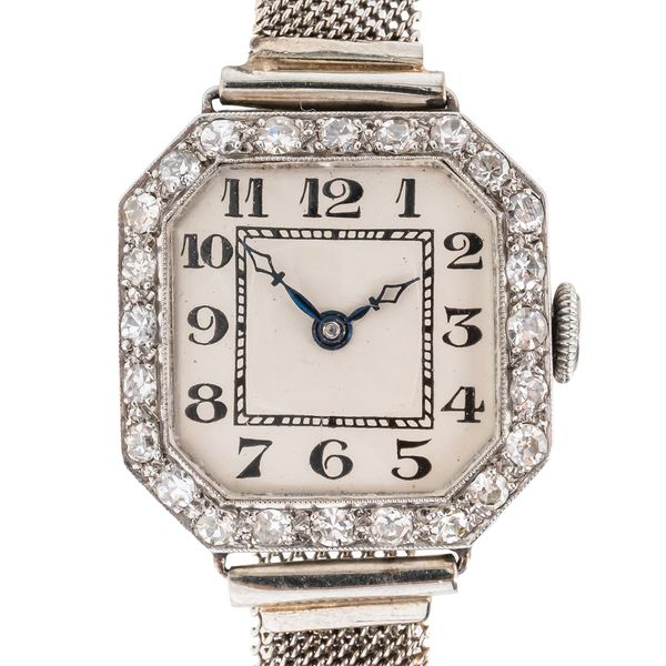 A LADY'S PLATINUM AND DIAMOND SET DRESS WRISTWATCH