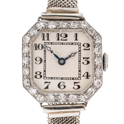 A LADY'S PLATINUM AND DIAMOND SET DRESS WRISTWATCH