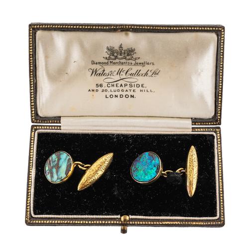 A PAIR OF GOLD AND BOULDER OPAL CUFFLINKS