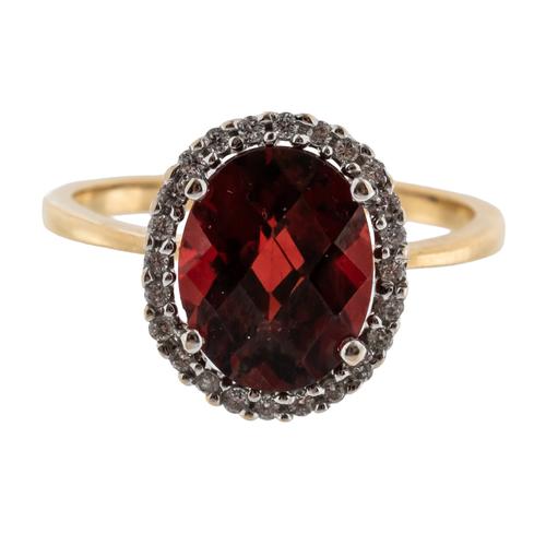 A DIAMOND AND GARNET RING
