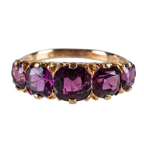 A FIVE STONE RHODOLITE GARNET RING (2)