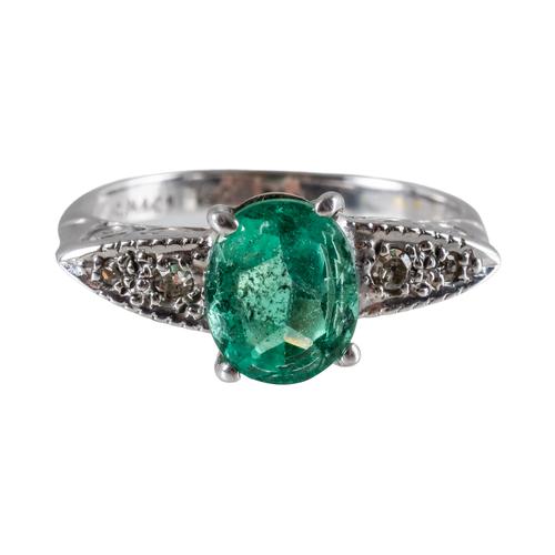 AN EMERALD AND DIAMOND RING