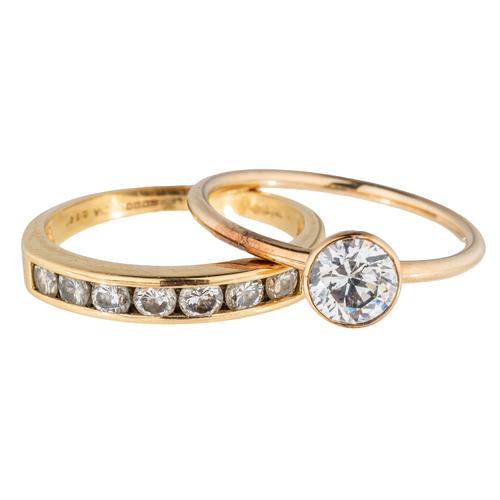 TWO WHITE STONE RINGS (2)