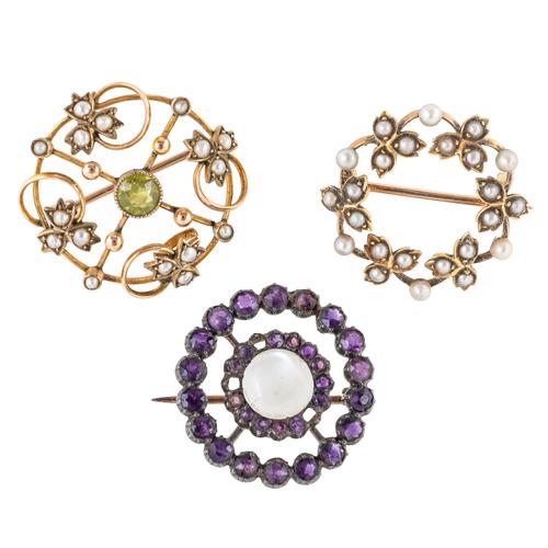 THREE CIRCULAR BROOCHES