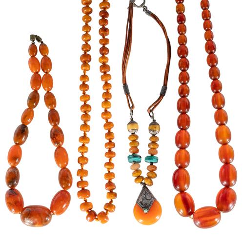 A COLLECTION OF MOSTLY AMBER NECKLACES (4)