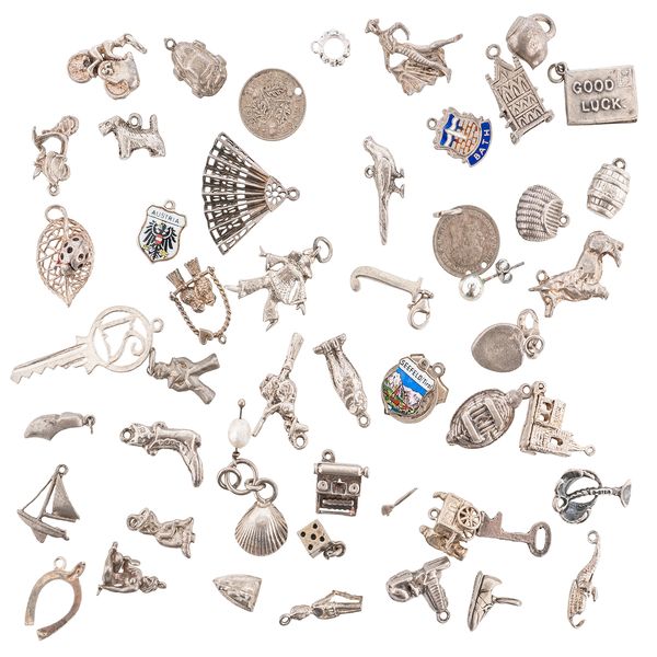 A BAG OF SILVER CHARMS (QTY)