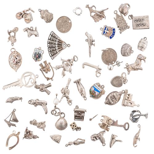 A BAG OF SILVER CHARMS (QTY)