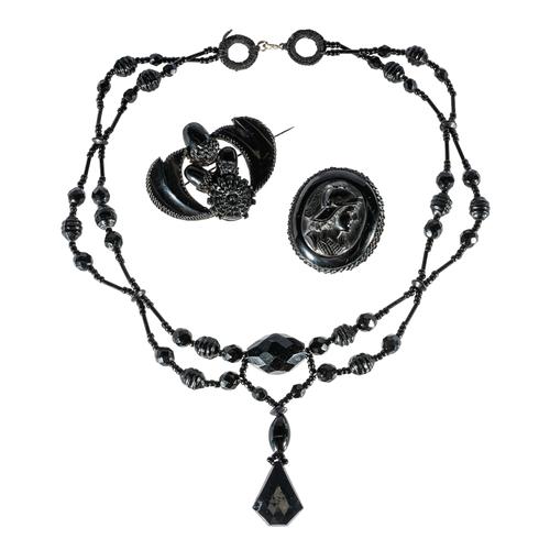 TWO JET BROOCHES AND A BEAD NECKLACE (3)