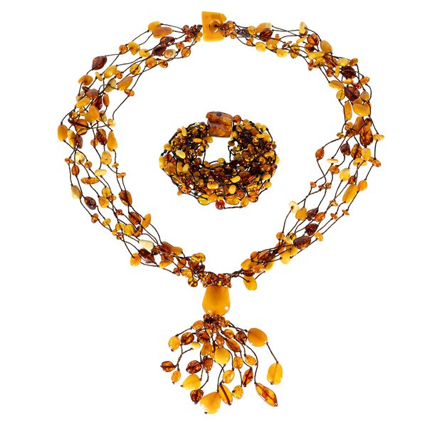 A VARICOLOURED AMBER MULTIPLE ROW PENDANT NECKLACE AND A SIMILAR BRACELET (2)