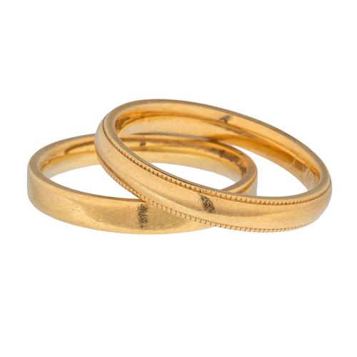 TWO 18CT GOLD WEDDING RINGS (2)