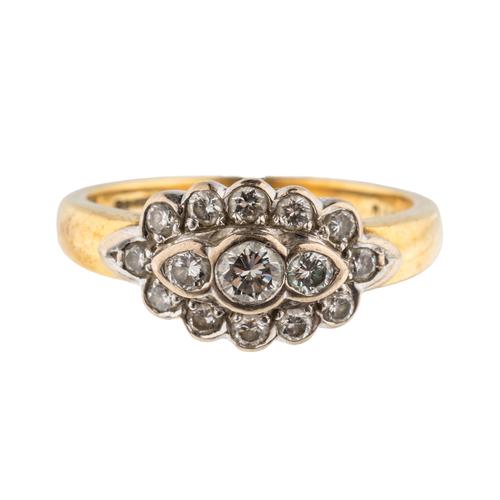 AN 18CT GOLD AND DIAMOND OVAL CLUSTER RING