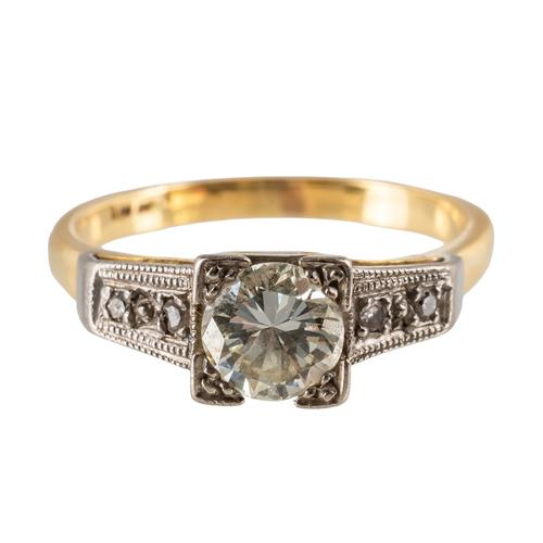 A GOLD AND DIAMOND RING