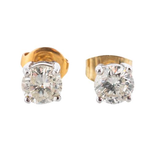 A PAIR OF 18CT GOLD AND DIAMOND SINGLE STONE EARSTUDS
