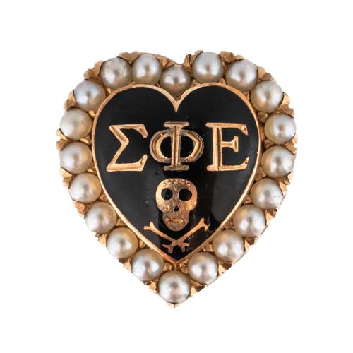 A BLACK ENAMELLED AND HALF PEARL SET MASONIC BROOCH