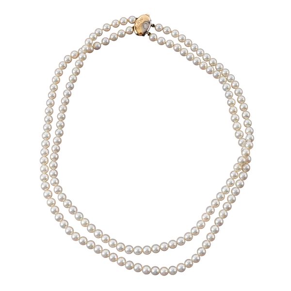 A MAPPIN AND WEBB TWO ROW NECKLACE OF CULTURED PEARLS ON A GOLD AND DIAMOND OVAL CLASP