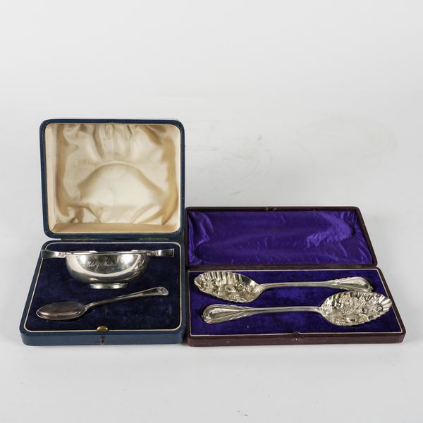 A SILVER TWIN HANDLED CHRISTENING BOWL, AN ASSOCIATED SILVER SPOON AND A PAIR OF PLATED FRUIT SERVING SPOONS (4)