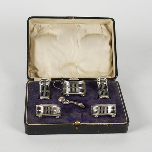 A SILVER FIVE PIECE CRUET SET