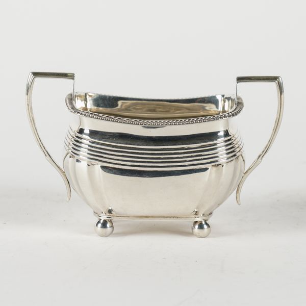 A SILVER TWIN HANDLED SUGAR BOWL